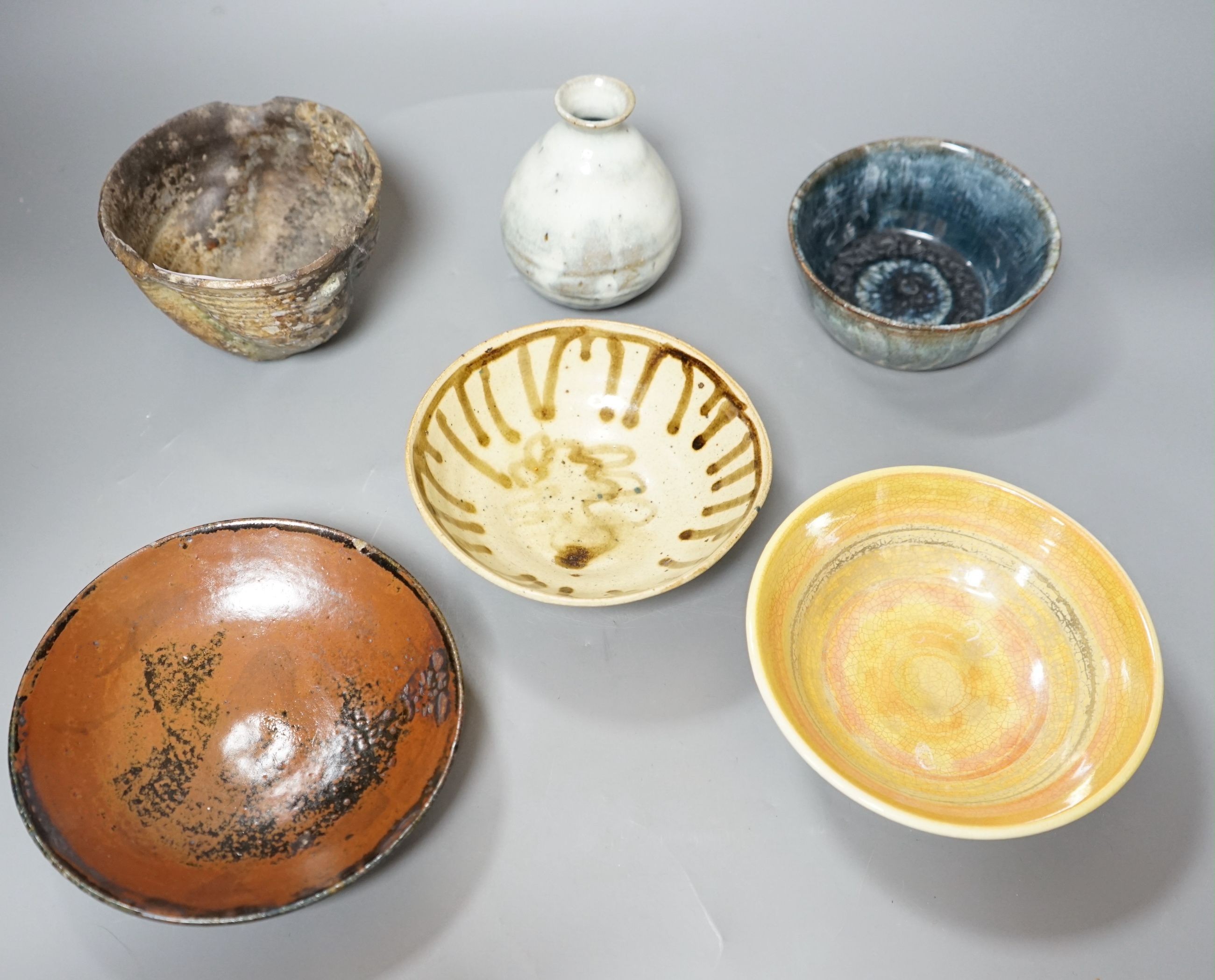 Studio pottery; a group of three bowls, a tenmoku dish, a small vase and a large cup, some marked, tallest 12cm, (6)